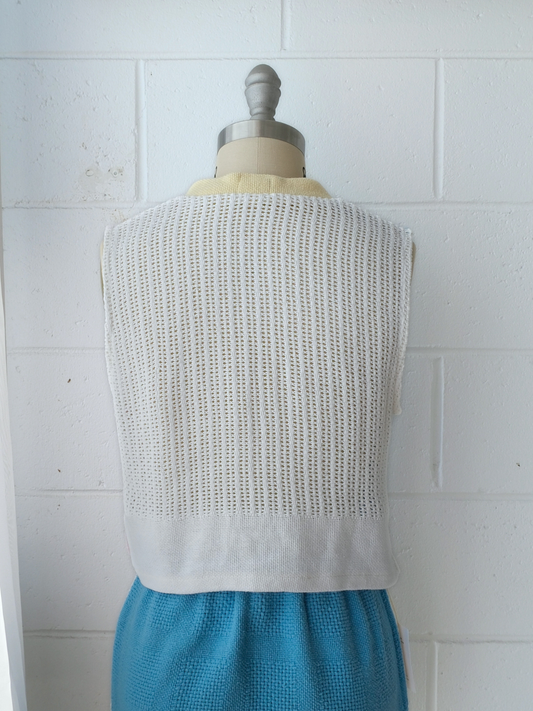 light pink, blue and white spliced knitted v neck vest with yellow contrast bind. handmade in Byron bay upcycled from 100% cotton blankets sustainable fashion