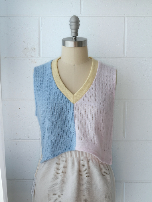light pink, blue and white spliced knitted v neck vest with yellow contrast bind. handmade in Byron bay upcycled from 100% cotton blankets sustainable fashion 