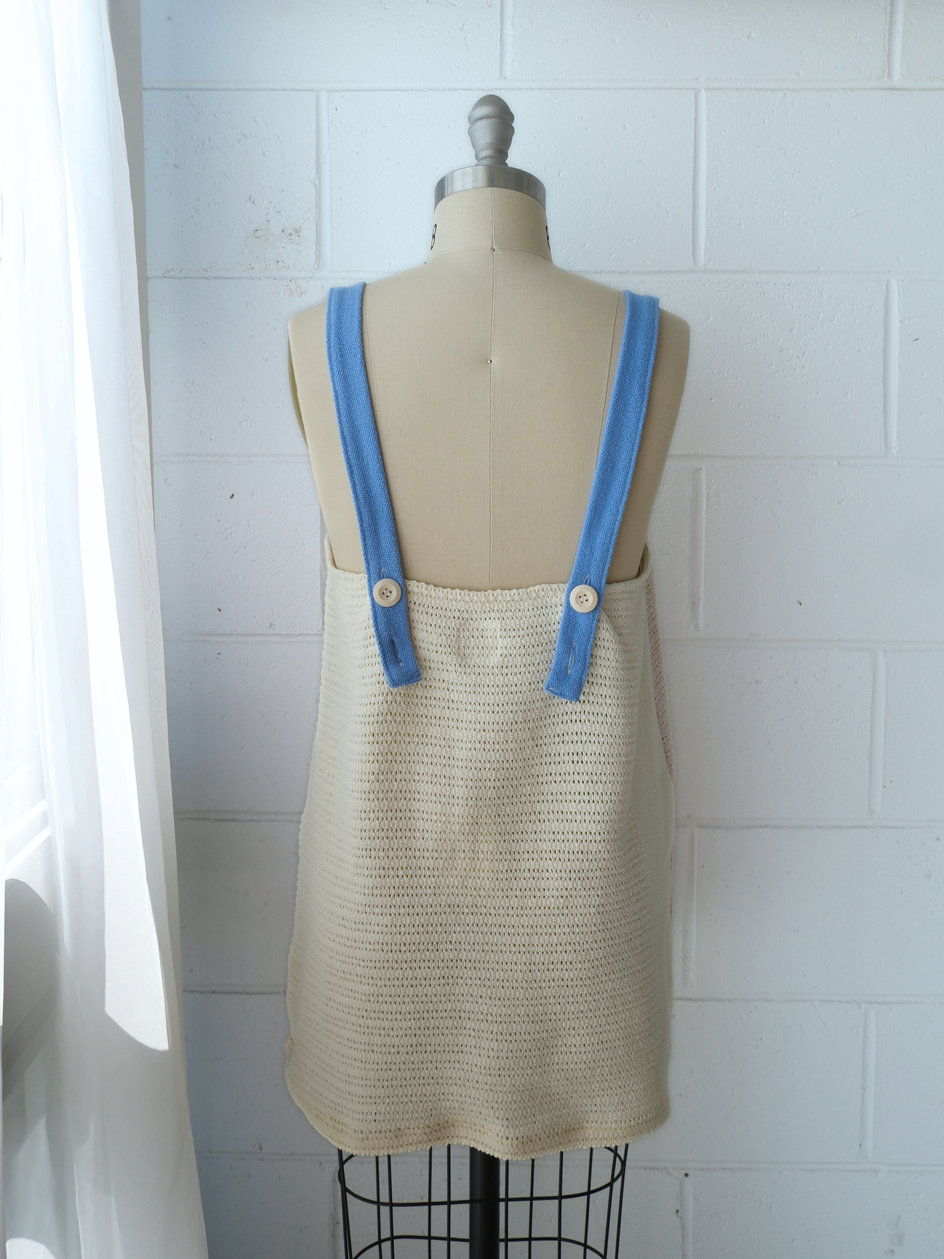 Peach pink knitted 100% cotton shift mini shift / tunic dress / pinafore with blue contrast adjustable straps and butter yellow back. Handmade upcycled from 100% cotton blankets made in byron bay 